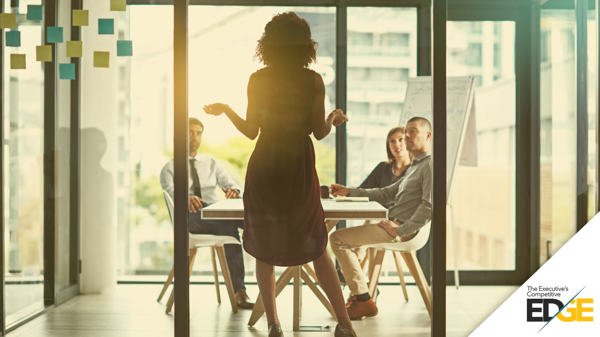 Woman leading a board meeting in a modern office